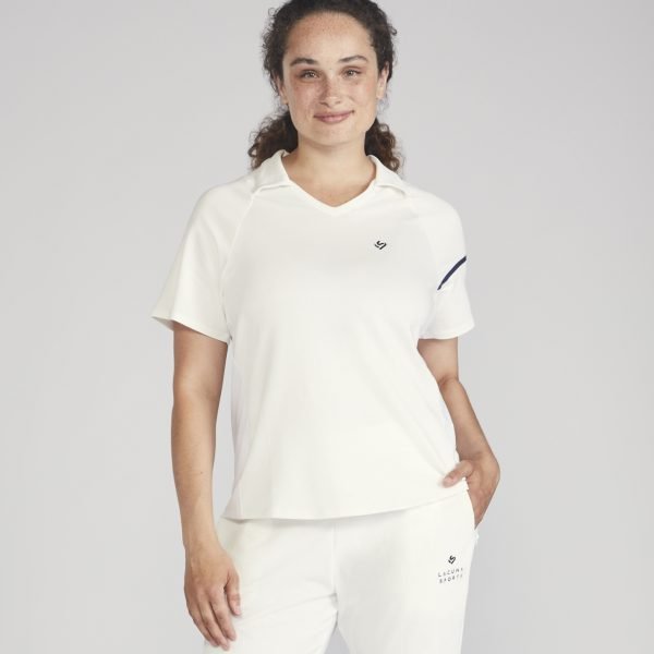 Female cricket player wearing a white Spin Short Sleeved Top