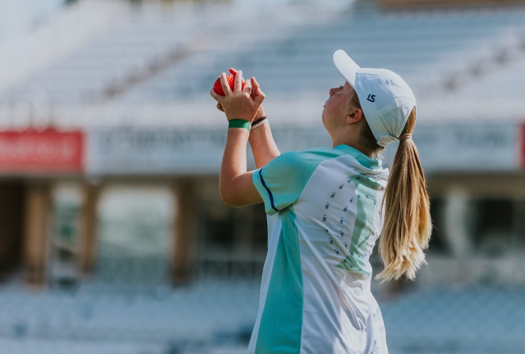 Girl with cricket ball