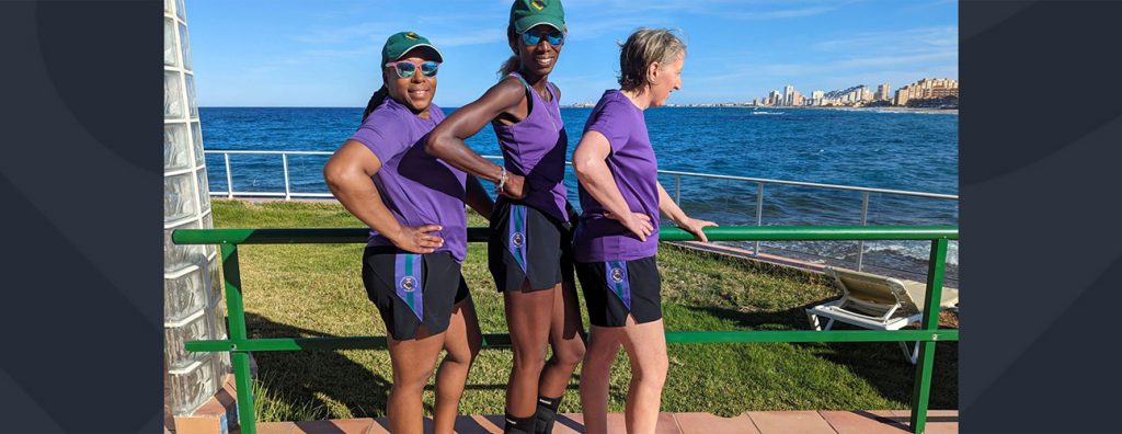 Female cricketers in purple tops